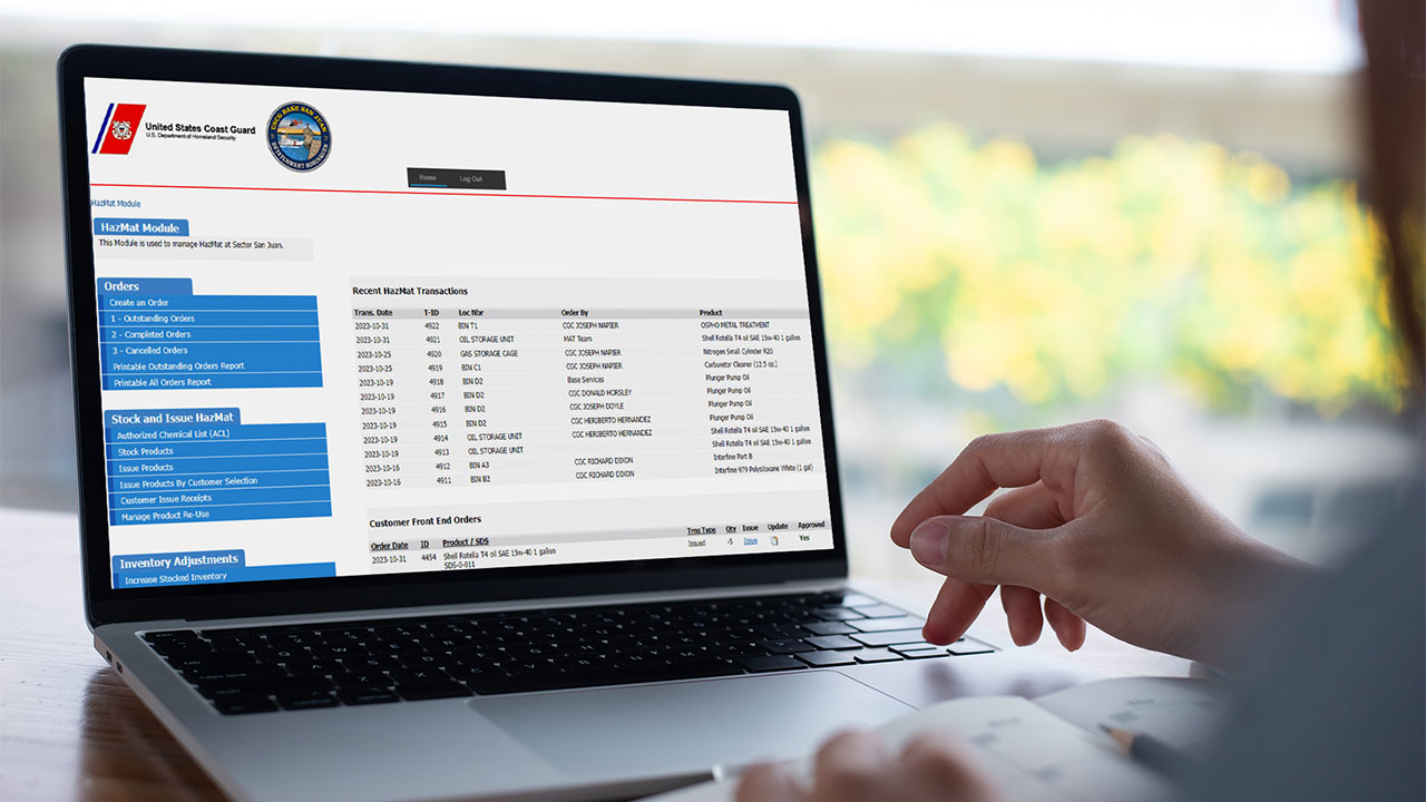 A person looking at a laptop displaying the HazMat Module dashboard